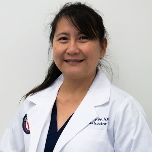 A smiling woman wearing a white lab coat with a name tag and the title 'Sherry Do, Nurse Practitioner.'